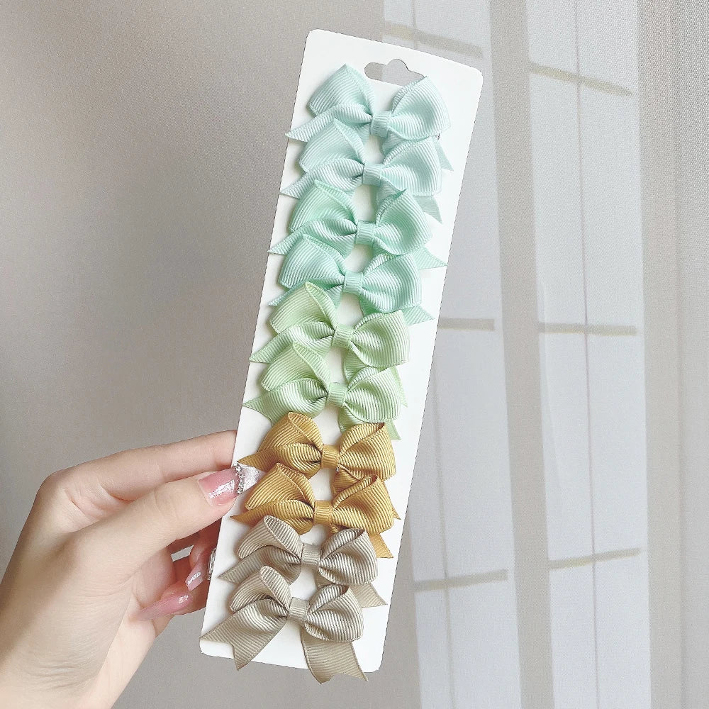 10Pcs/Set Solid Color Kids Bows Hair Clips for Baby Girls Handmade Ribbon Bowknot Hair close-up view