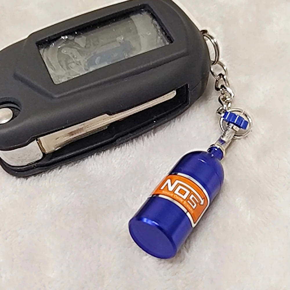 NOS Bottle Keychain Keyring | Metal Pill Box Stash Container for Car Keys lifestyle view