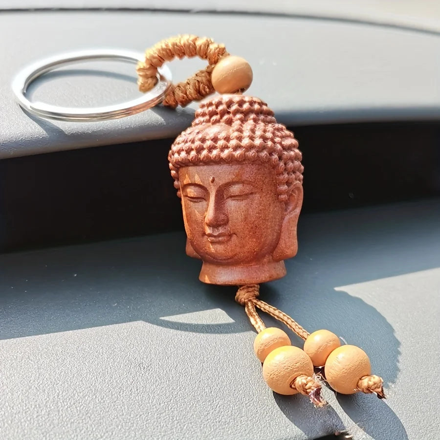 Buddha Head Carved Wood Keychain | Peach Wood Key Ring detail view