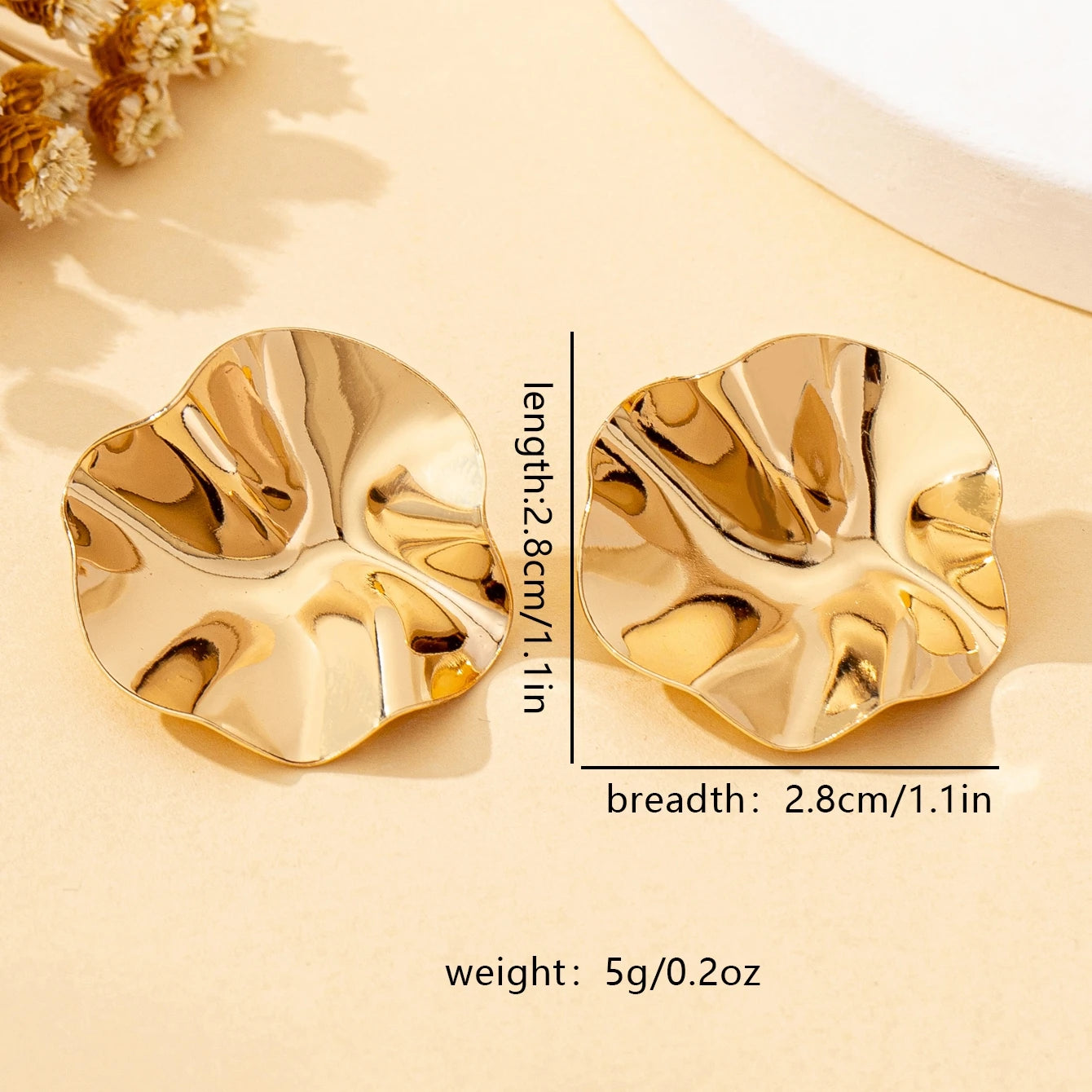 A Pair of Irregular Round Metal Stud Earrings Jewelry close-up view