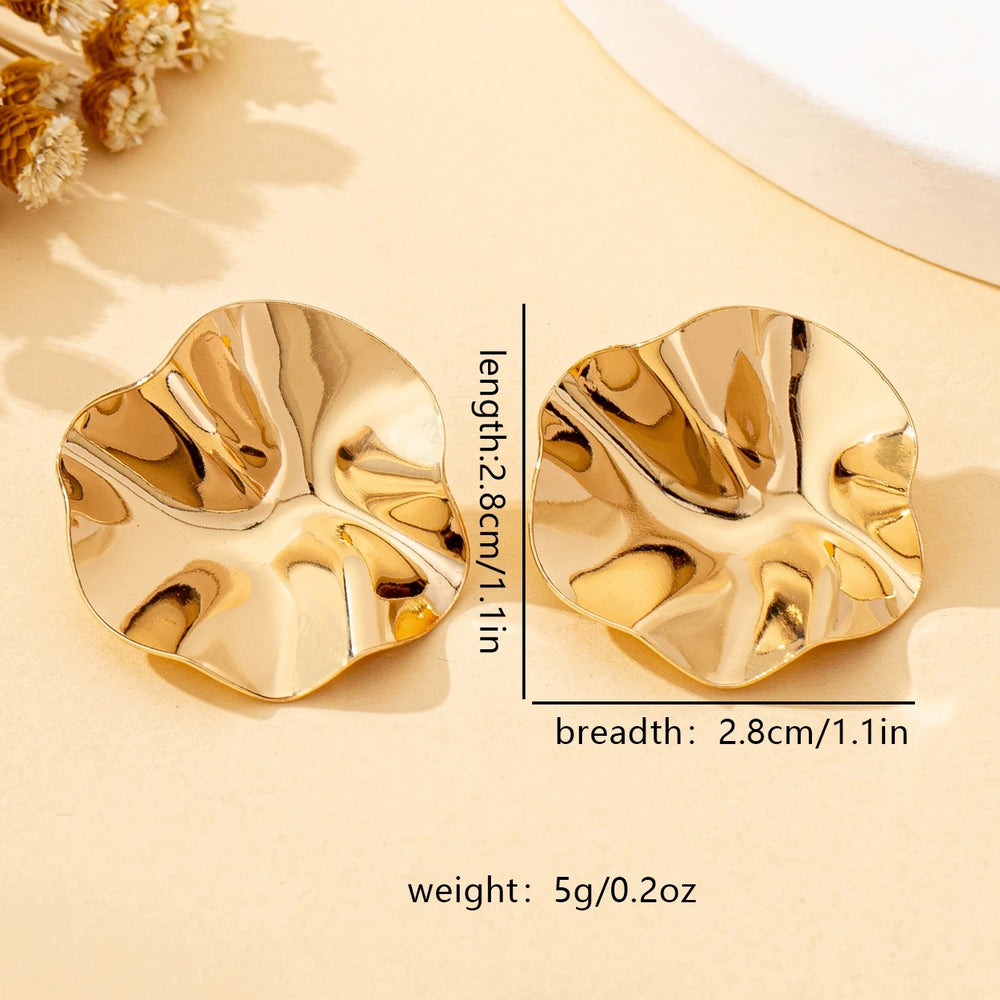 A Pair of Irregular Round Metal Stud Earrings Jewelry close-up view