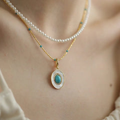 Natural Turquoise Oval Shell Pendant Necklace | Gold Chain Collarbone Jewelry close-up view