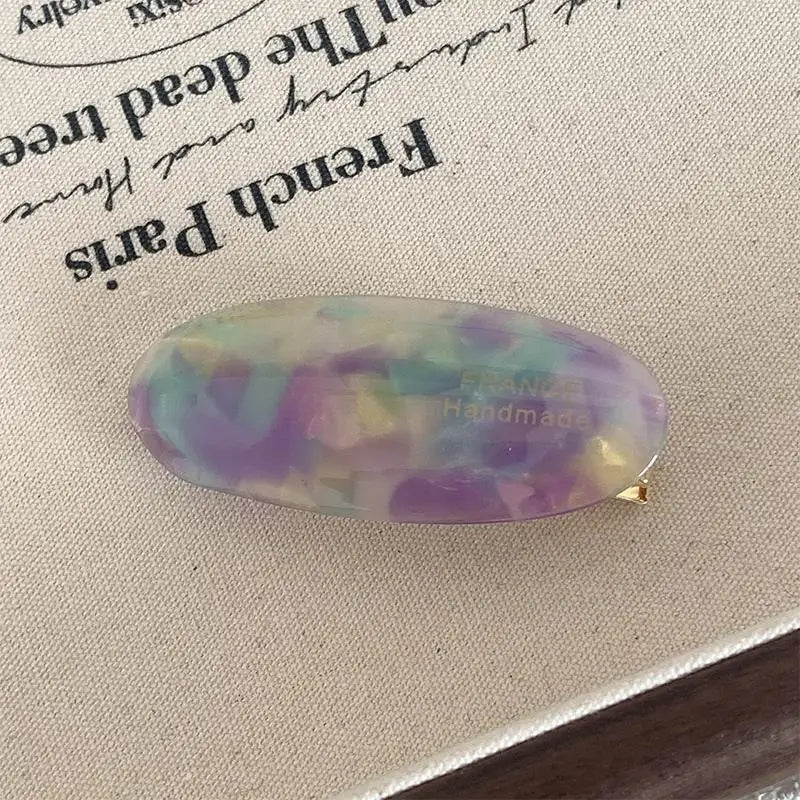 Elegant French Style Hair Clips for Women Simple Retro Oval Acetic Acid Barrettes Ligh close-up view