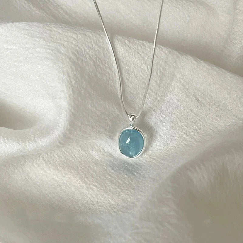 Oval Aquamarine Pendant Necklace | Snake Chain Jewelry for Women close-up view