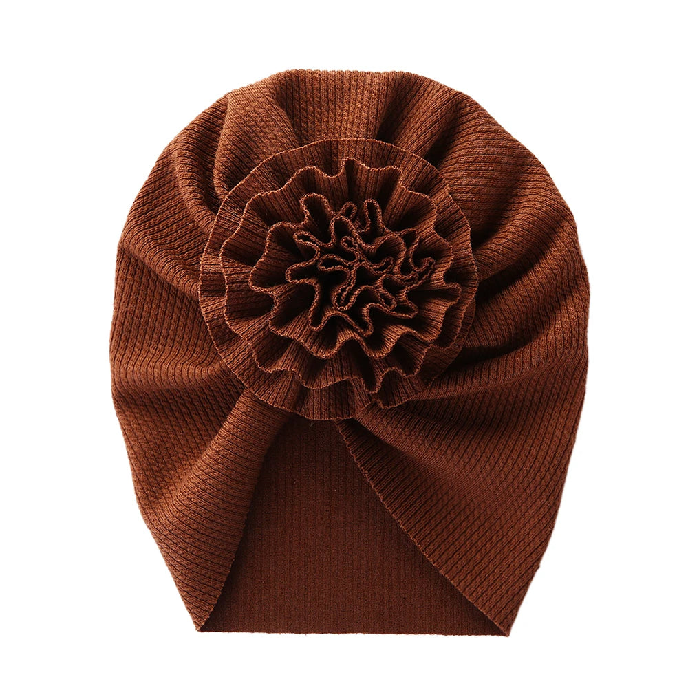 Big Blossom Flower Ribbed Turban Baby Hat | Soft Cotton Topknot Bonnet for Newborns an close-up view