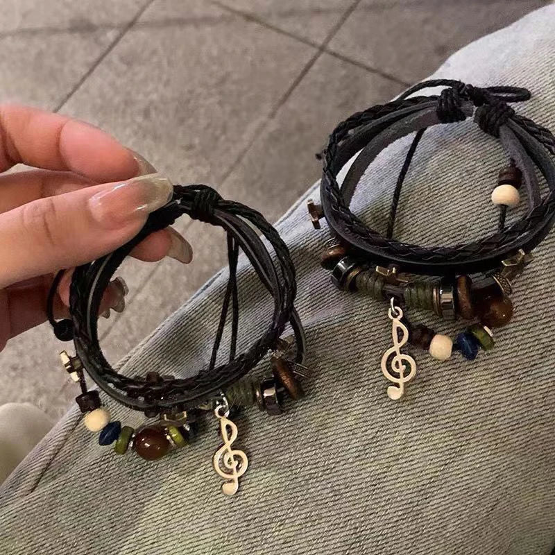 Handmade Hippie Design Brown Leather Bracelet Women Metal Star Note Charms Wood Button close-up view