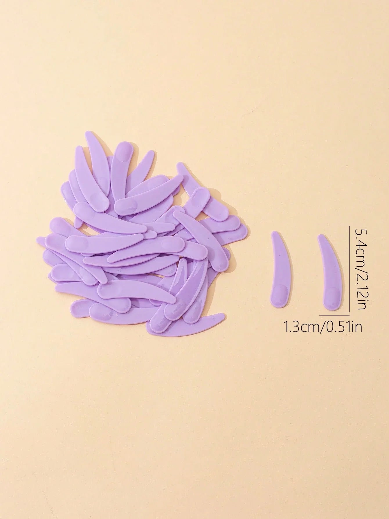Plastic Face Cream Spoon Set | 50-Pack Crescent Spoons for Skincare close-up view