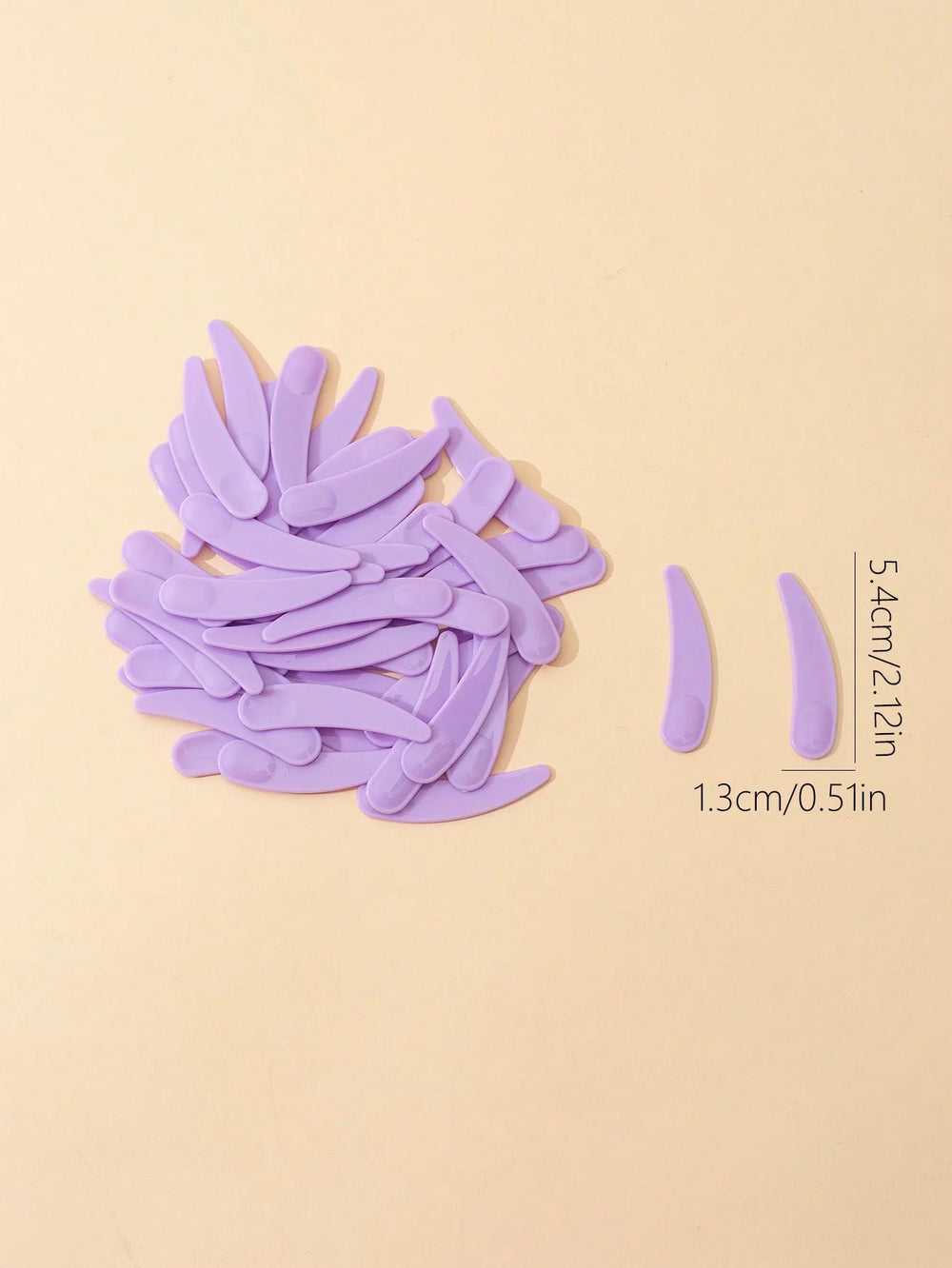 Plastic Face Cream Spoon Set | 50-Pack Crescent Spoons for Skincare close-up view