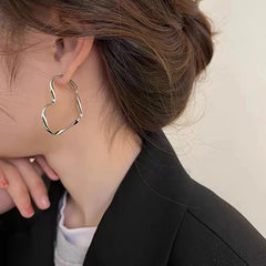 Trendy Hollow Heart Earring Cuff | Fashion Hoop Earrings for Women close-up view