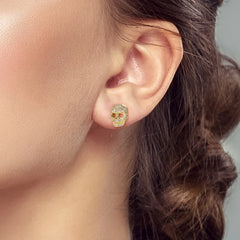 925 Sterling Silver Skull Stud Earrings | Shiny Gold Finish for Women close-up view