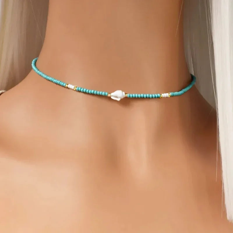 White Glass Seed Bead with Beaded Conch Shells Necklace close-up view