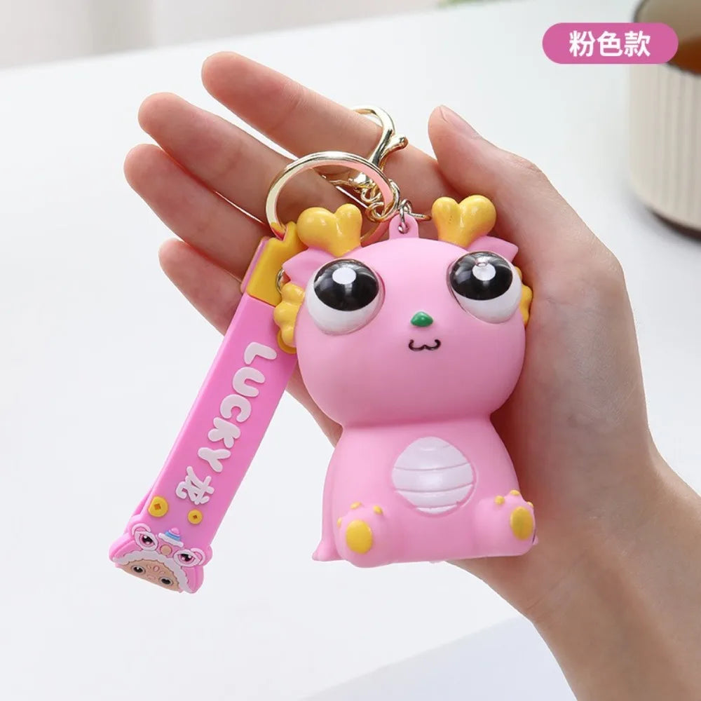Big Eyed Dragon Squishy Toy | Pop Eyes Fidget Keychain for Stress Relief alternate view