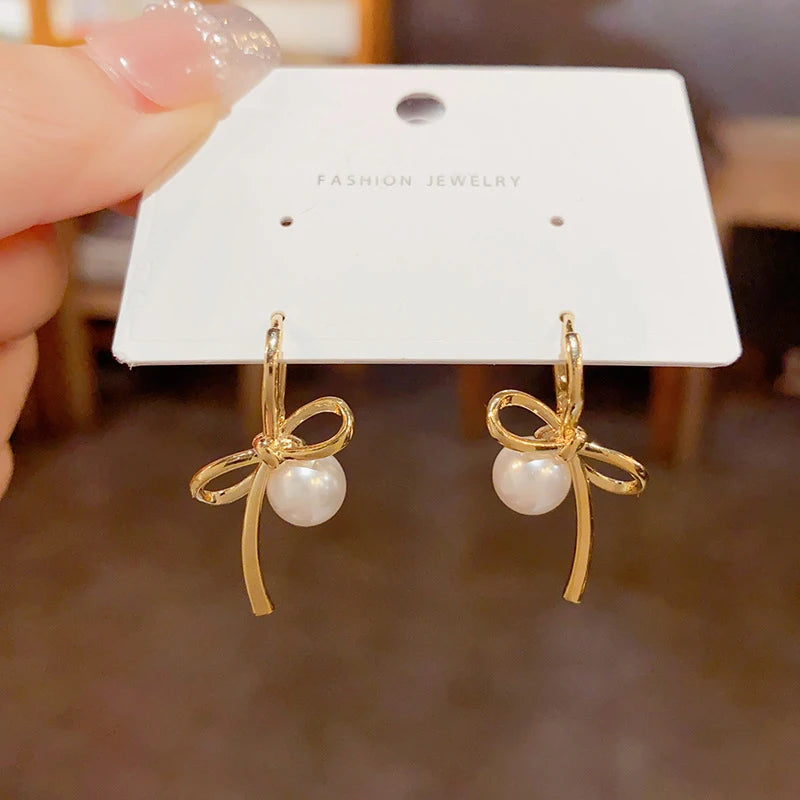 PANJBJ 925 Sterling Silver Bow Knot Earring for Women Texture Tassels Sweet Romantic lifestyle view
