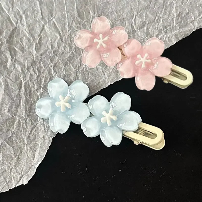 Jelly Cherry Blossom Hair Clips Pink Blue Flower Hairpins for Girl Romantic Wave Side close-up view