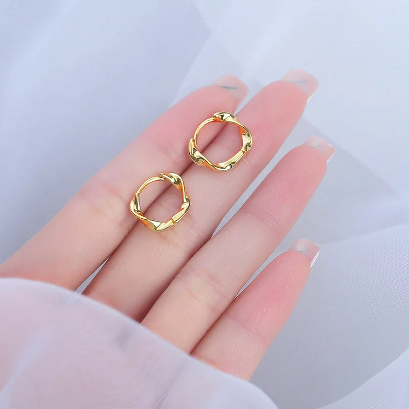 Silver Hoop Earrings | Trendy Distorted Round Earrings for Women close-up view