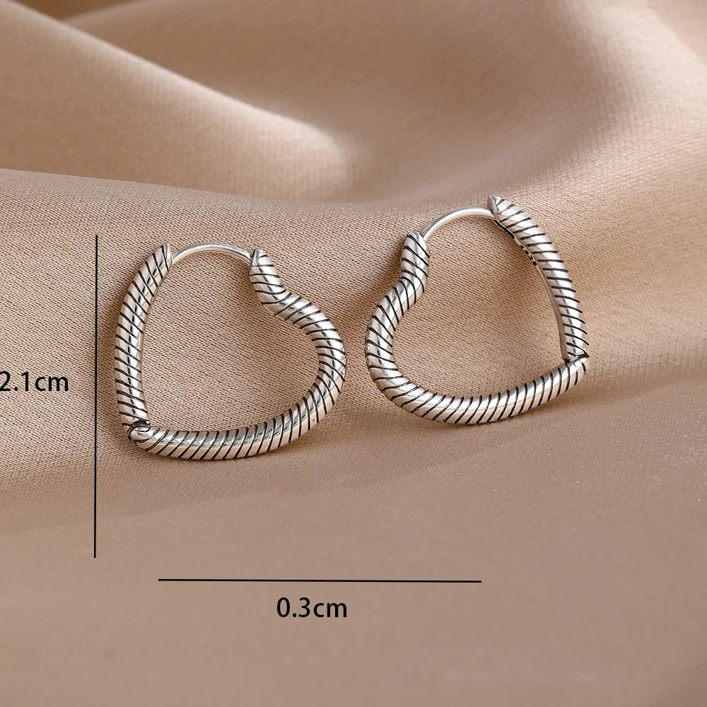 2026 New 925 Silver Butterfly Shining Zircon Heart shaped Earrings Suitable for Europe close-up view
