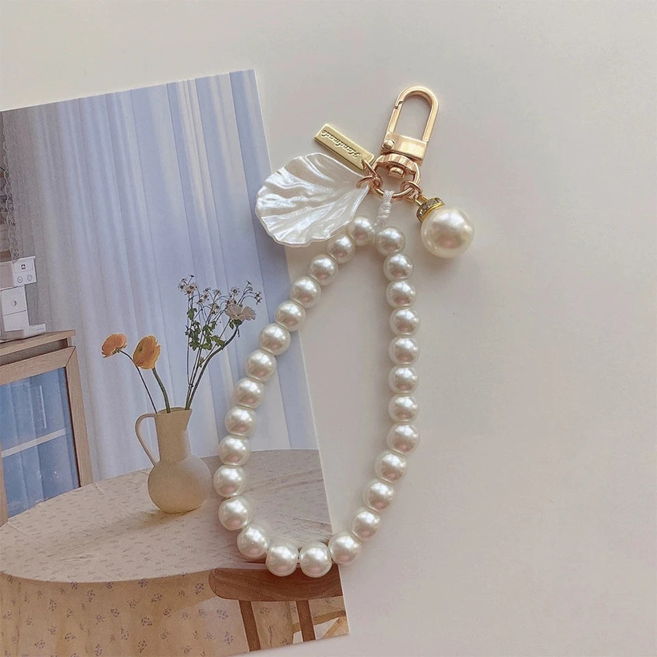 ZAKOL Cute Pearl Keychain for Women Girls Shiny Pearl Bead Shell Phone Bag Backpack Ch close-up view
