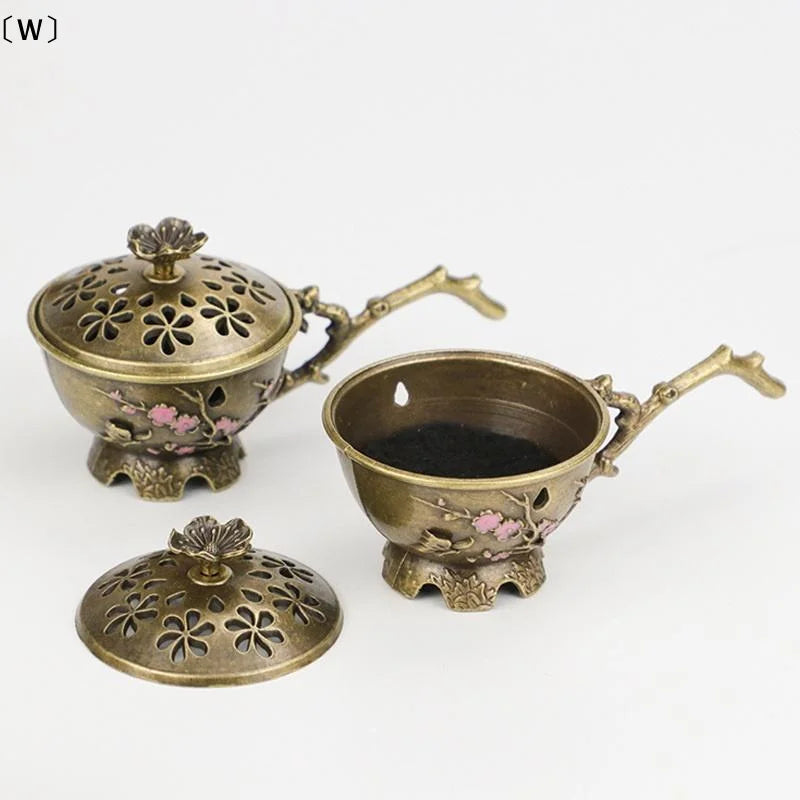 Handheld Plum Blossom Incense Burner | Retro Hollow Out Incense Stick Holder with Hand close-up view