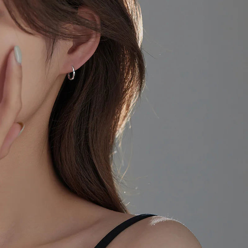 Silver Hoop Earrings | Trendy Distorted Round Earrings for Women lifestyle view