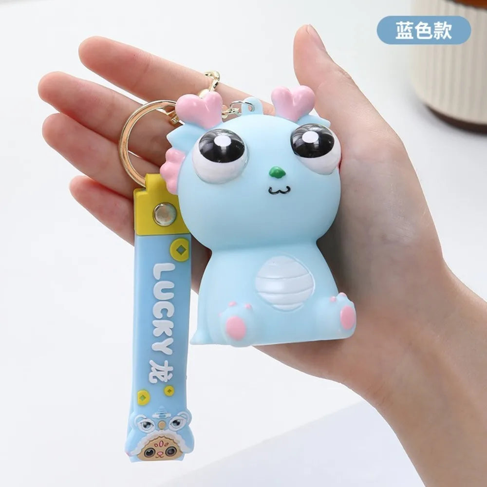 Big Eyed Dragon Squishy Toy | Pop Eyes Fidget Keychain for Stress Relief additional angle
