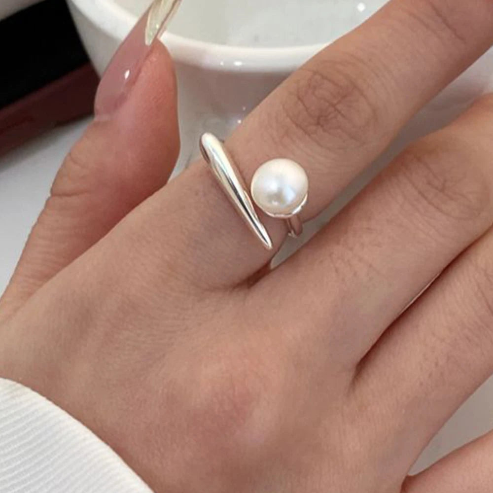 PANJBJ 925 Sterling Silver Pearl Irregular Ring for Women Shell Overlapping Hollow Swe close-up view