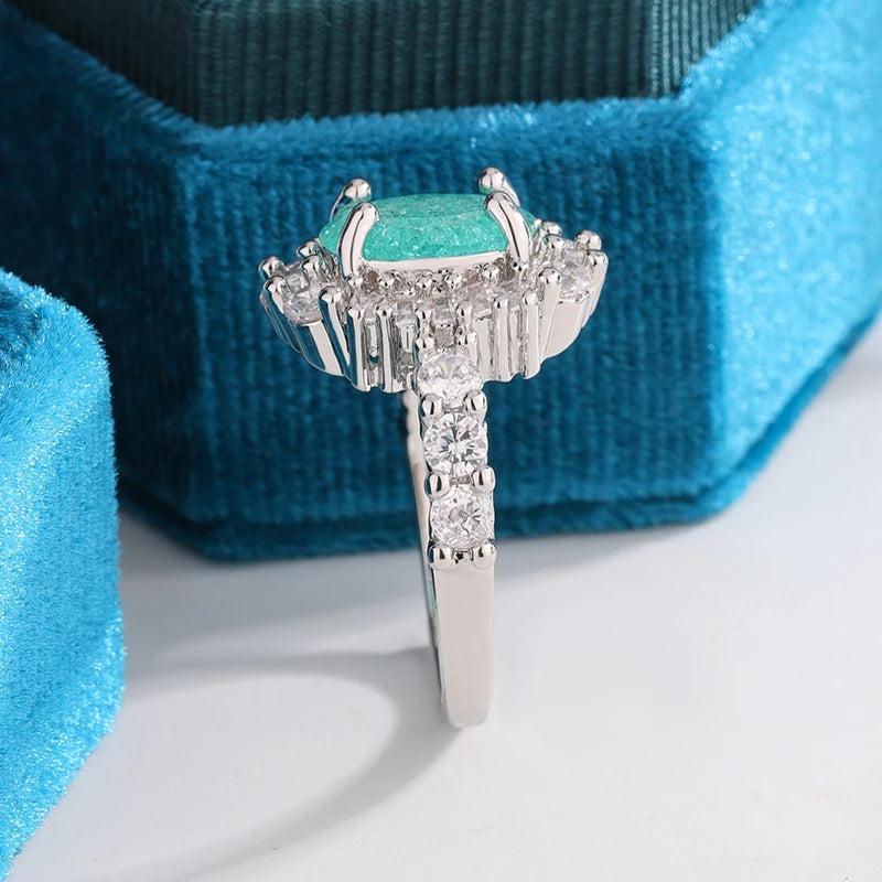 925 Silver Plated Luxurious Paraiba Sapphire Oval Full Diamond Couple Ring For Women E close-up view