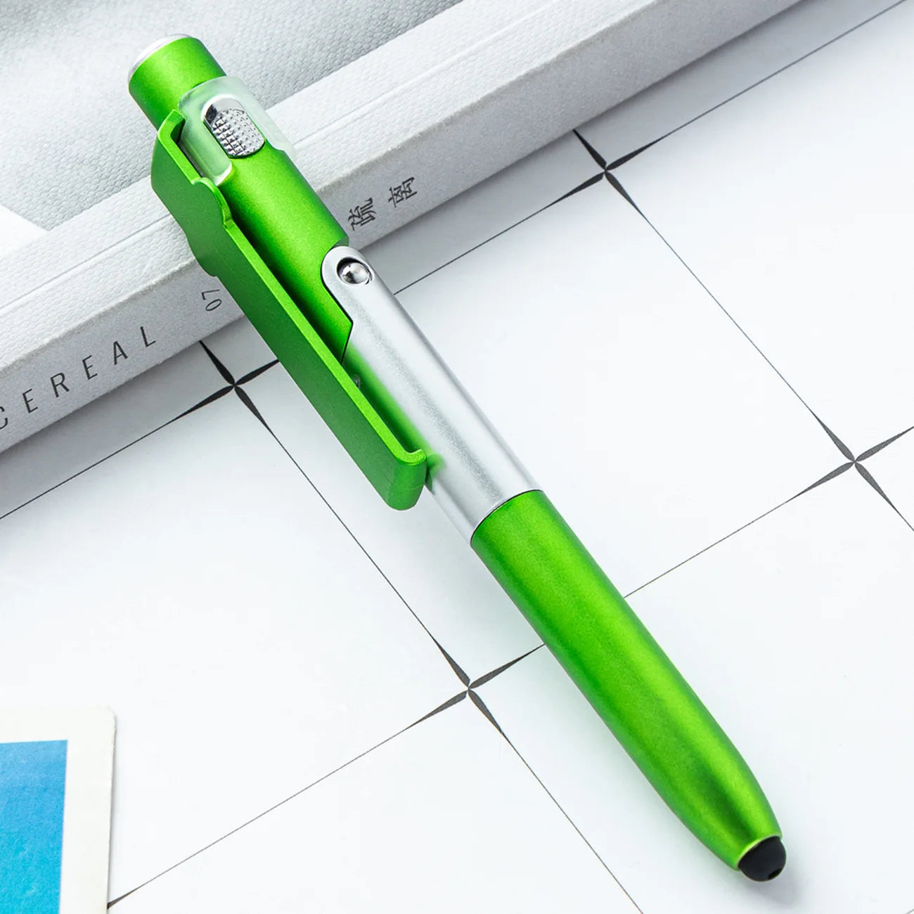 4 In 1 Multifunction Ballpoint Pen with LED Light Fold Phone Holder Night Read Writing close-up view