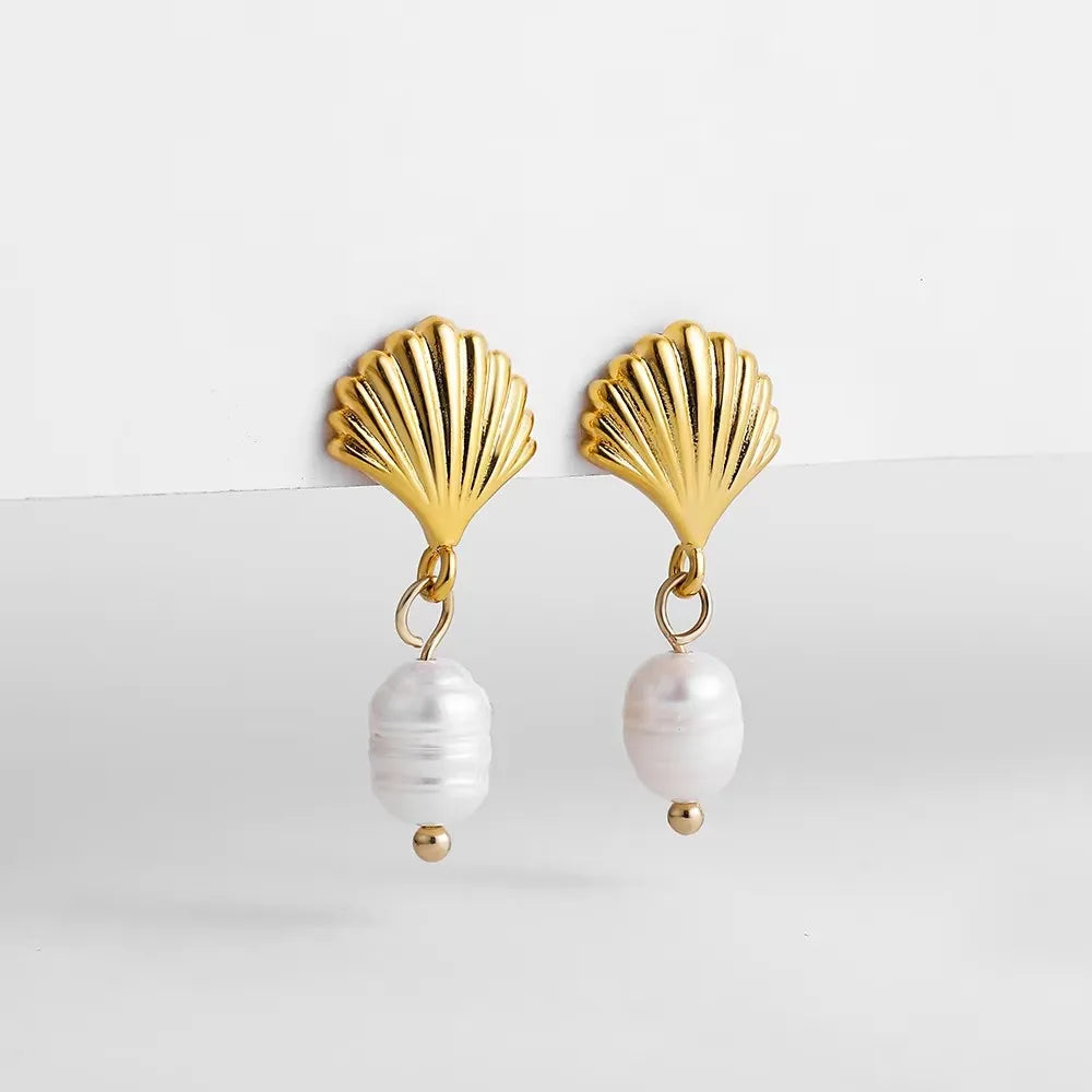 Vintage Gold Snail Shell Drop Earrings | CZ Zircon Beach Jewelry for Women close-up view