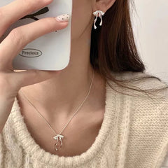 PANJBJ 925 Sterling Silver Bow Knot Earring for Women Texture Tassels Sweet Romantic K close-up view