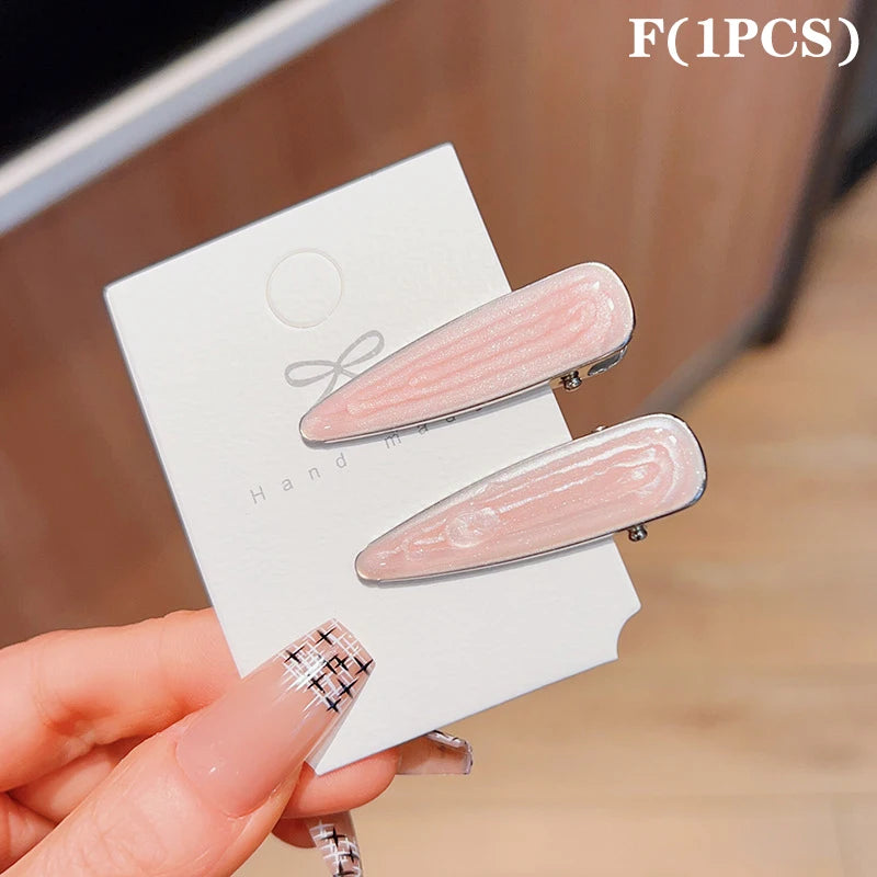 Simple Wave Oval Pink Seamless Hair Clip Women Acetate Bangs Duckbill Hairpins Styling close-up view