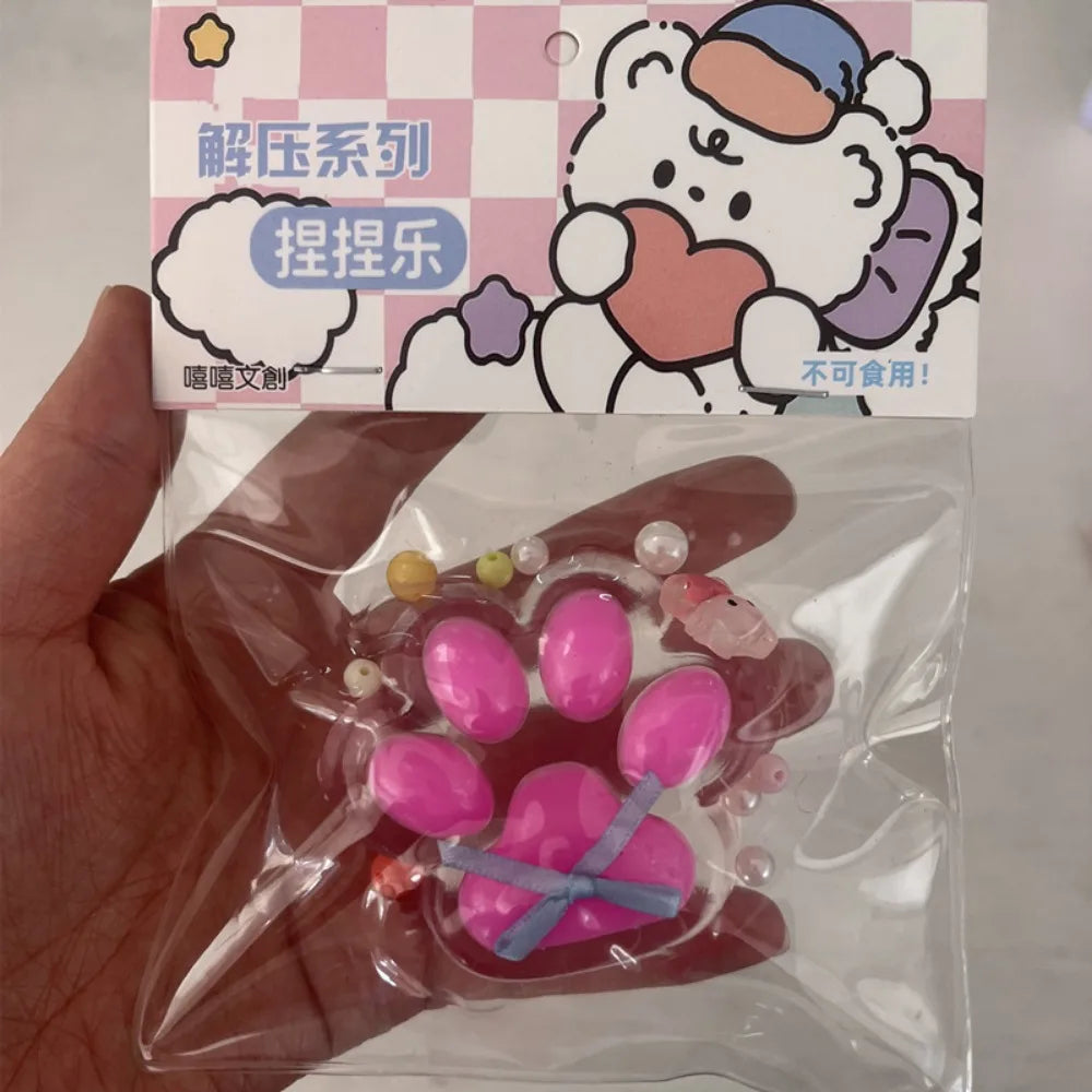 Taba Squishy Bow Cat Paw Fidget Toys | Cute Pink Cat Foot Slow Rebound Toy lifestyle view